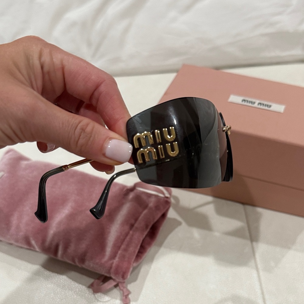 Miu Miu Black and Gold Sunglasses